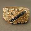 14kt Gold Ring with 5 black diamonds