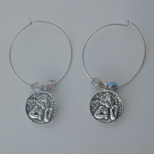 Sterling silver hoop with a sterling silver cherub flanked by two clear Czech glass beads.