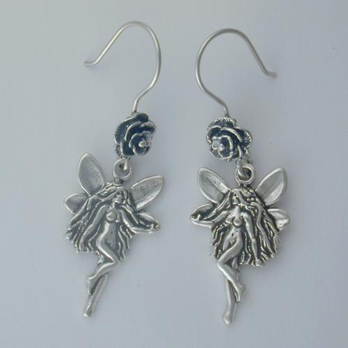 Sterling silver fairy with a rose decorate these French Wire earrings