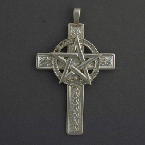 This 2 1/4 inch cross has a discreet foral pattern and a one inch pentagram.