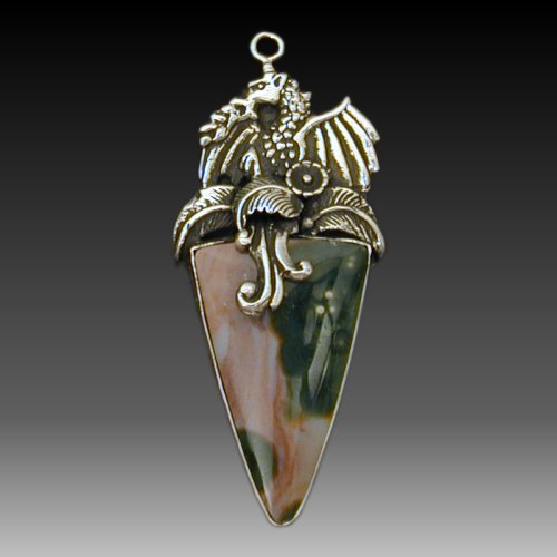 This flaming dragon rises from a pool of ocean jasper. See the leaves and flowers on the shore of his tropical island.