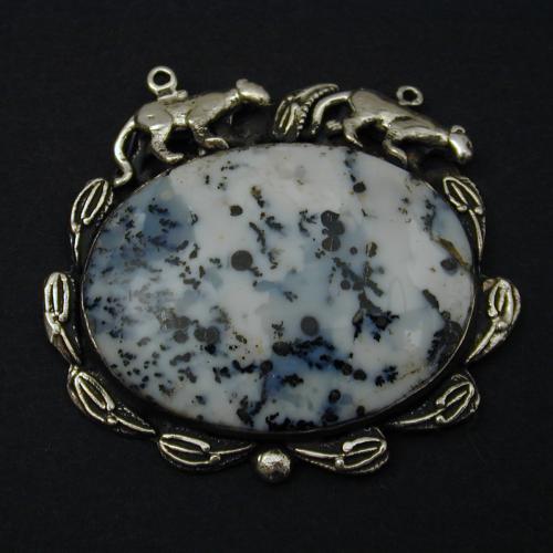 Imagine wild snow leopards walking along a mountain of dendritic agate in the snow. The color of the stone is reminiscent of the colors of the snow leopards.