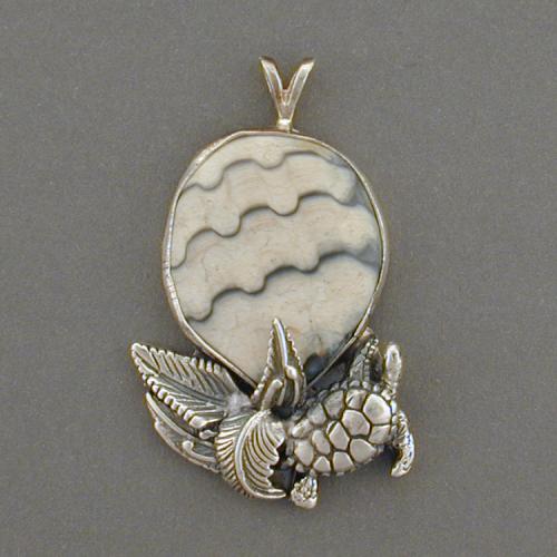 Enjoy this unique fossilized shell and turtle pendent. Imagine the rippling water in the patterns of the shell.