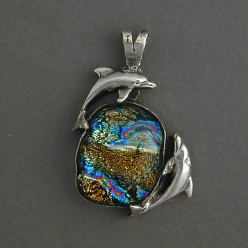 Watch the dancing dolphins swimming in the swirling waves of this beautiful dicroic glass. Feel the dance.