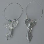 Sterling silver hoop with a sterling silver angel flanked by two clear Czech glass beads.