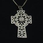 This lovely celtic cross holds an moonstone cabochon. 