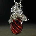 Pool of Flame - Sterling silver dragon setting in leaves beside a beautiful pool of red flames.  The pool is formed from a piece of red Paua shell.
