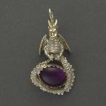 This dragon holds an oval Amethyst protectively in its coiled tail.