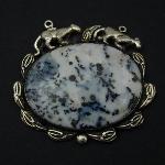 Imagine wild snow leopards walking along a mountain of dendritic agate in the snow. The color of the stone is reminiscent of the colors of the snow leopards.