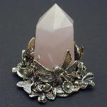 Fairies and butterflies dance around this pink quartz point in a celebration of the coming Spring Season.