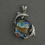 Watch the dancing dolphins swimming in the swirling waves of this beautiful dicroic glass. Feel the dance.